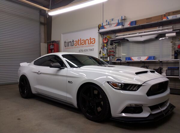 White Ford Mustang GT 5.0 with ceramic window tint installation at Tint Macon Macon