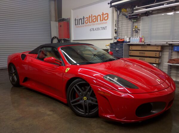 Red Ferrari F430 Spider convertible with premium window film at Tint Macon shop