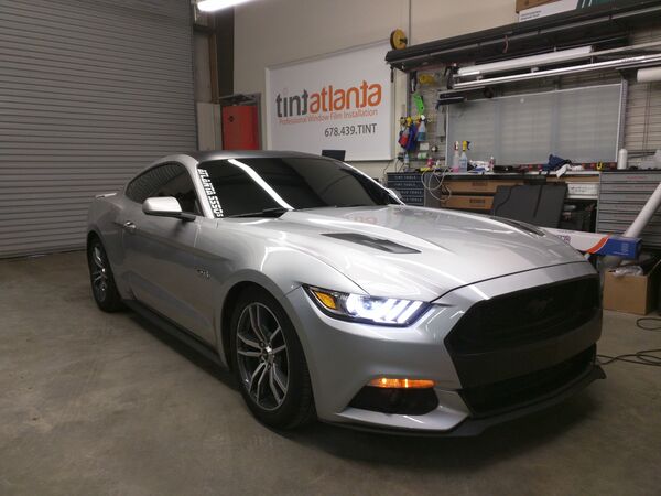 Silver Ford Mustang GT with dark ceramic window tint in Macon GA