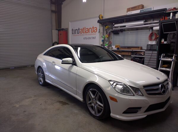White Mercedes-Benz E-Class Coupe with professional window tinting Macon