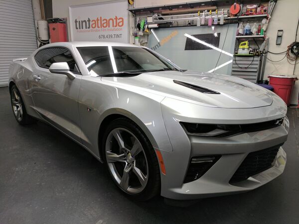 Silver Chevrolet Camaro SS with dark window tint installation Macon